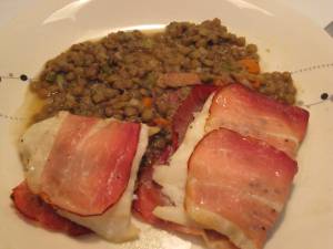 Baked cod wrapped in prosciutto